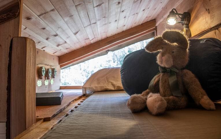 Clanranald has a playful 'bothy platform' which can sleep older children/teens/small adults. It is accessed by a hand-made ladder from the double bed below. There is a selection of books and 'treasure' for young ones to use during their stay
