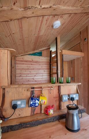 The kitchen counter tops in each Bothy are made from thick slabs of Douglas Fir, and the mug rails are made from copper piping and brass rings used by plumbers. Our teapots are painted by an artisan who lives on a canal boat :)