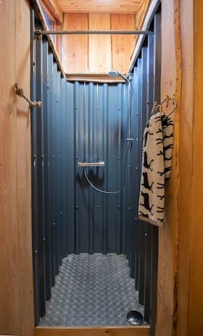 Metal shower trays were made locally for us, and the shower area is lined in box profile tin, in a nod to the tin roofs popular in the last century in Scotland. Our bath mats are organic cotton, by Anorak