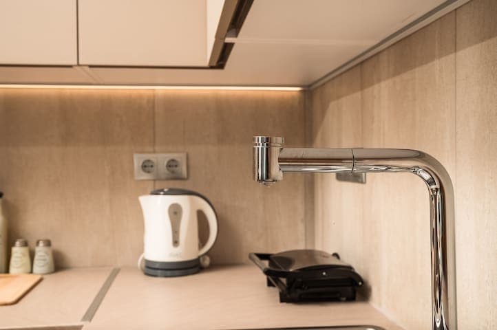 You can heat your water or make a hot toast with our toaster. Also, the tap water is drinkable.