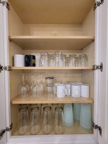 Set of glasses, mugs, and plastic cups.
