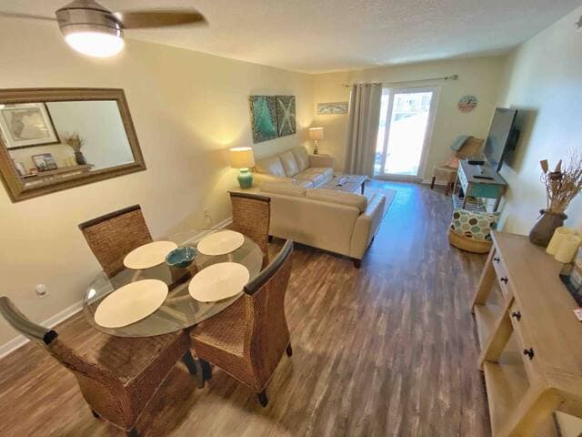 Open floorplan with dining & living area for family meals and watching favorite shows on the 55" Smart TV.