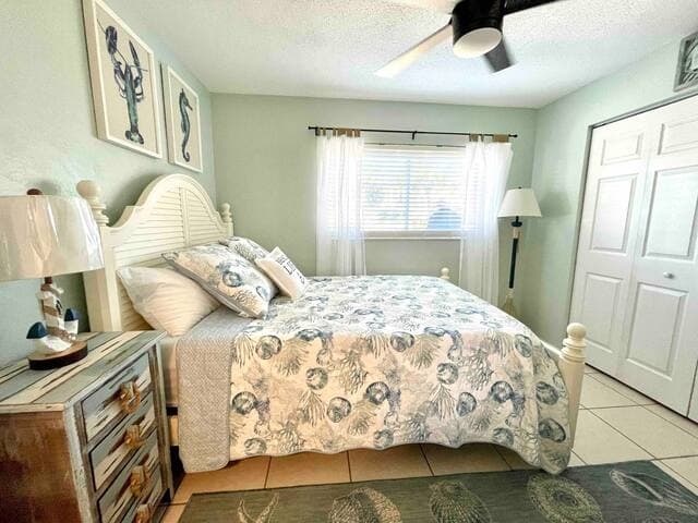 Second bedroom features a queen bed and smart TV.