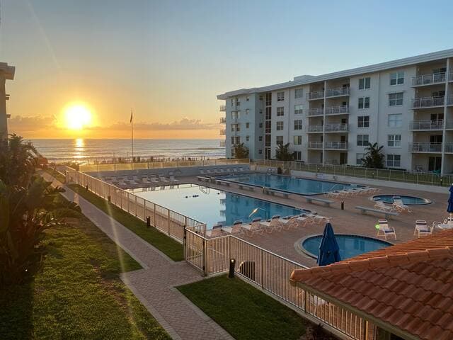 View from balcony out over pools to the ocean! We often see dolphins & sailboats.