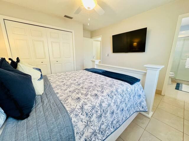 Large Smart TV in primary bedroom