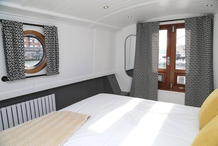 View of the double bedroom showing the doors that lead to the outside seating area.