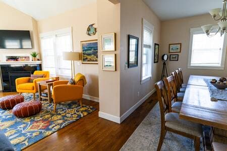 The dining room and living are part of the lovely open second floor of the house, with the kitchen just to the right, out of the photo