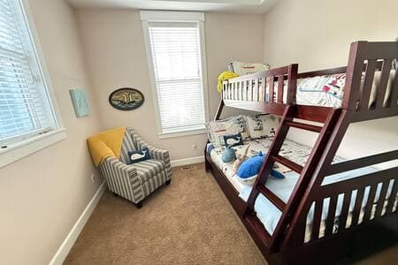Our kids' bedroom has a bunk, with a twin mattress on top, a double on the bottom, and also a trundle twin mattress (pulls out like a drawer from under the double).