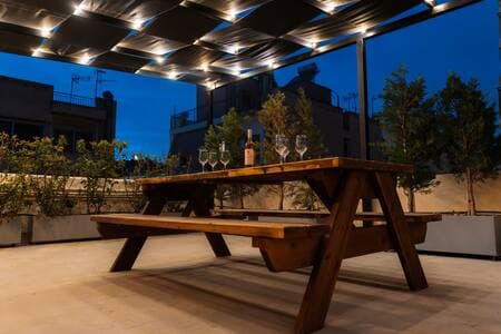 Enjoy views of Filopappou Hill as you relax with a glass of wine on the terrace.