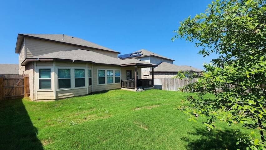 Indulge in outdoor bliss on our expansive back patio, boasting lush green grass a perfect setting for sizzling barbecues and al fresco dining. Relax in the embrace of nature as you savor delicious grilled delights with family and friends.