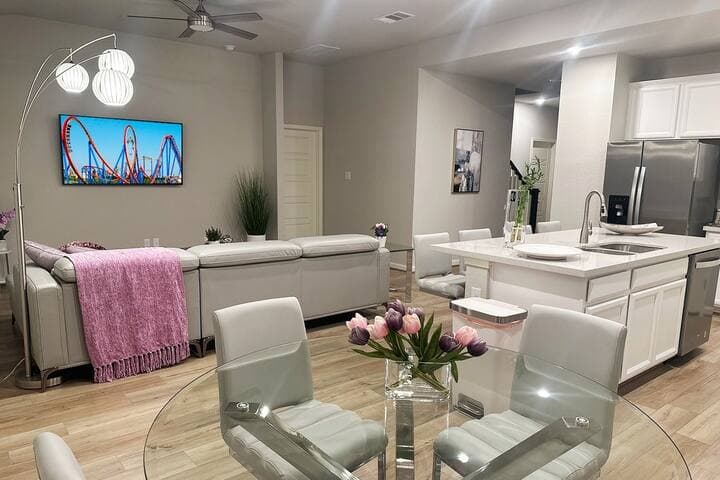 Welcome to our open-concept living area, seamlessly blending the living room, kitchen, and breakfast nook with a view of the backyard. Enjoy the spacious layout as you cook in our fully equipped kitchen, perfect for preparing meals.