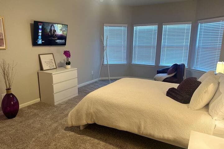 Welcome to our spacious Master bedroom, designed for your ultimate comfort and relaxation. Enjoy serene views of the backyard, creating a peaceful retreat just for you.