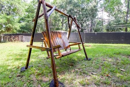 Wooden swing to unwind outside and enjoy the outdoors.