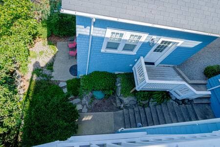 View from top deck of the stairway between the house and ADU, the deck-like entrance to the ADU's game room, as well as stepping stones to the ADU patio, where the ADU queen ensuite is.