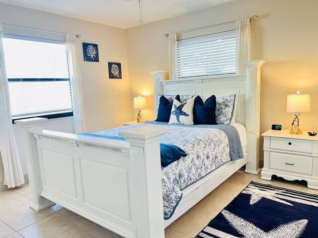 Primary bedroom features queen bed and en-suite bathroom