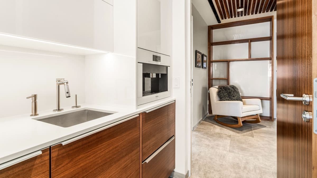 Primary bedroom wet bar, built in coffeemaker, and refrigerator drawers