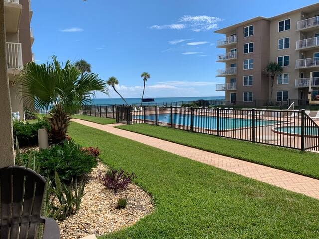 Poolside first floor condo with ocean views from our patio.