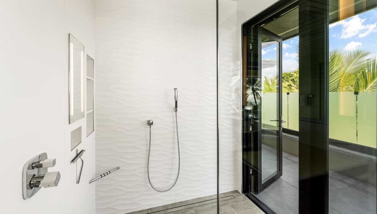 Walk-in shower with door to lanai