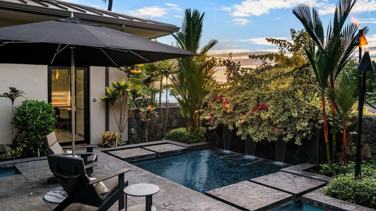 Courtyard seating area with salt water pond and water feature