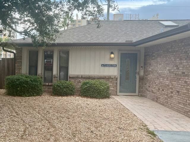 "It's A Beach Thing" is an attached home with a garage, driveway and fenced-in backyard.
