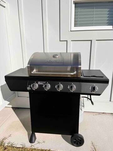 Propane grill with side burner.