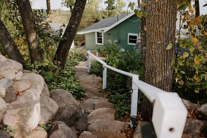 Natural stone steps lead down to the property. These steps are NOT suitable for those with mobility issues.