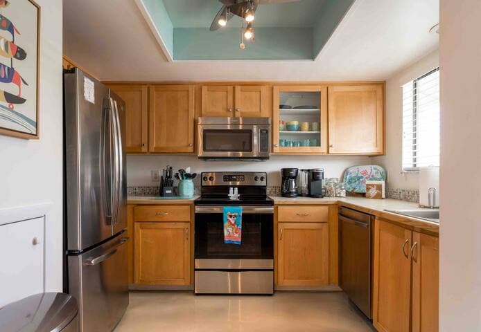 Well-appointed kitchen with many new appliances including, dinnerware, silverware, glassware, cookware & linens.
