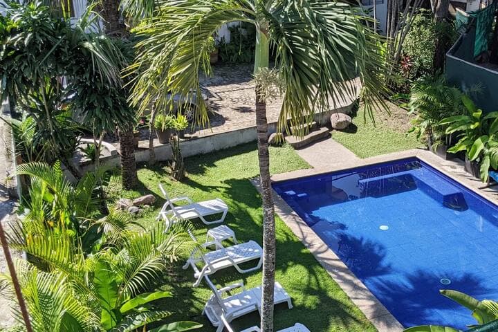 Pool view from the 1st primary king suite private patio.  Plenty of room for relaxing.