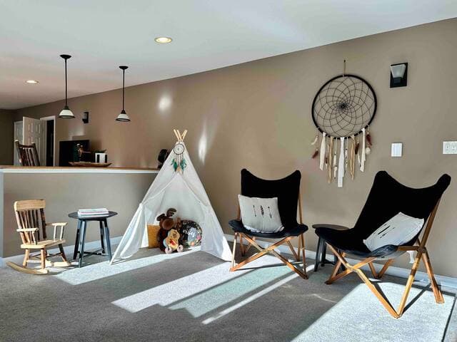 The tepee in the playroom encourages pretend play for kids - set up a camp fire, but watch out for bears!