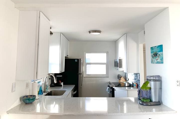 Fully appointed kitchen with all new stainless appliances, frozen concoction drink machine, Keurig and regular coffee maker.