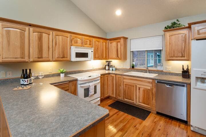 Fully equipped to include pots & pans, cooking utensils (i.e. spatulas, ladles, knives), mixing bowls, cutting boards, measuring cups & spoons, baking pans, dinnerware, glassware, flatware, and pantry staples ie. salt, pepper, oil, and spices.