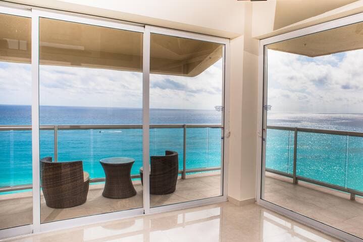 Relax on the wrap around balcony right off of the living room OR open the huge sliding doors to bring the outdoors inside!