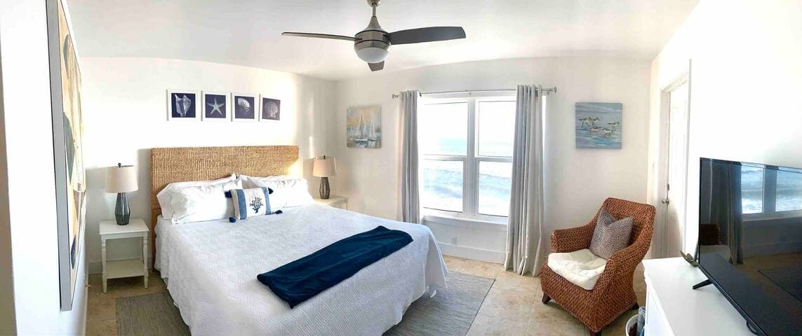 Plenty of room to stretch out and relax after a day at the beach in this master bedroom with en suite bath. 40” tv with cable, ample closet space, full dresser, and plenty of storage including room for luggage under bed.