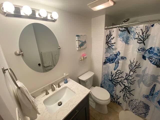 En suite master bath is completely renovated with stylish tile and new fixtures!