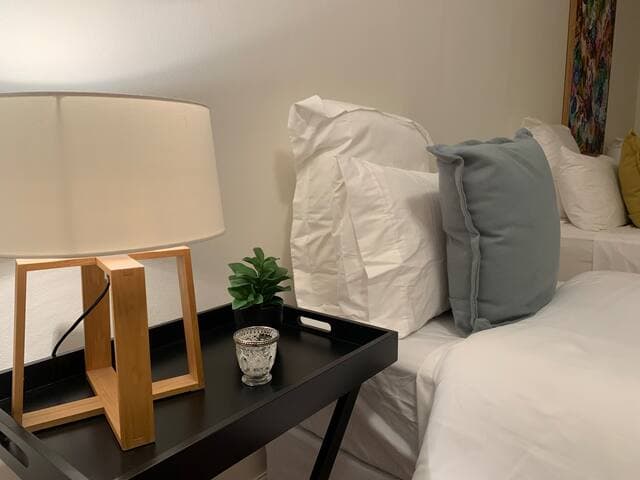 Spacious bedroom with comfortable beds and lush bedding supplied free of charge.