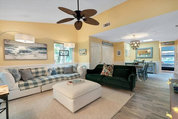 Spacious living area with large-screen TV.