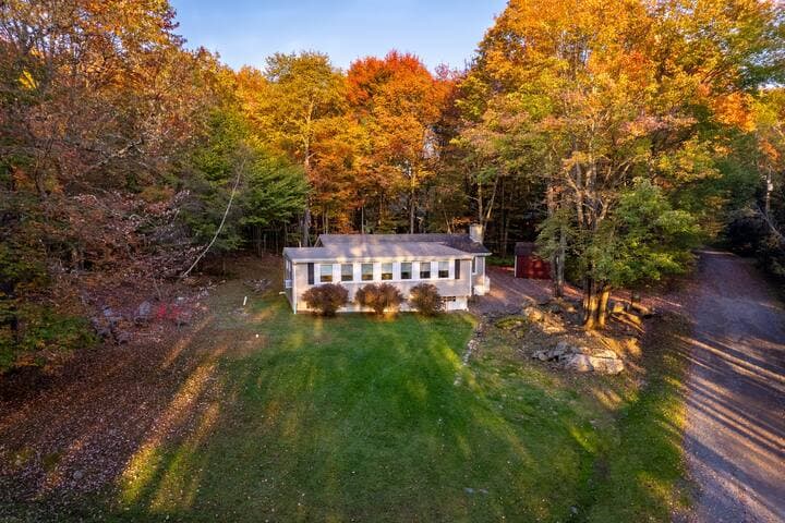 Large, flat front yard has plenty off space for or yard games and has a lake view