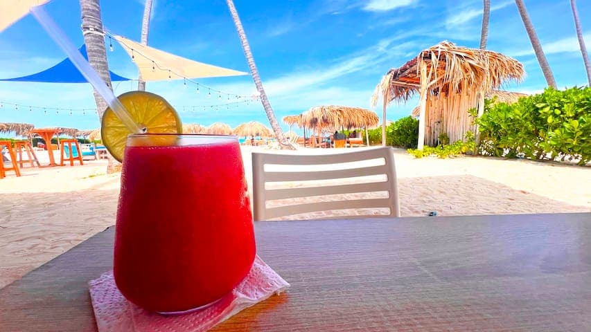 Enjoy your favorite frozen cocktail (or mocktail)  beach side at the local Villa Blanca Beach Club just a short walk from our front door.
10 min walk.