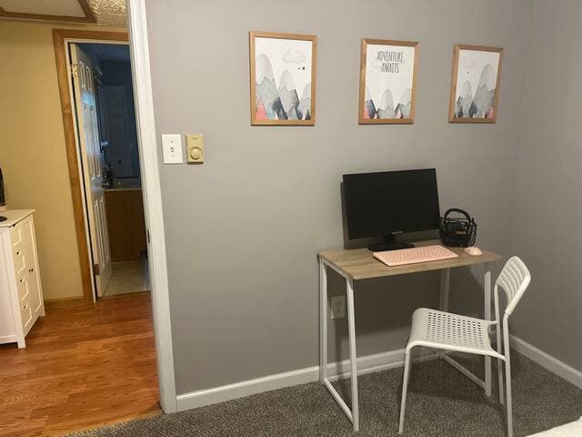 Desk with monitor, keyboard, mouse, headset and hdmi cord available