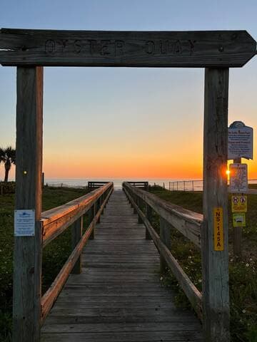 The Oyster Quay boardwalk access is across the street, approximately a 10-minute walk from the condo