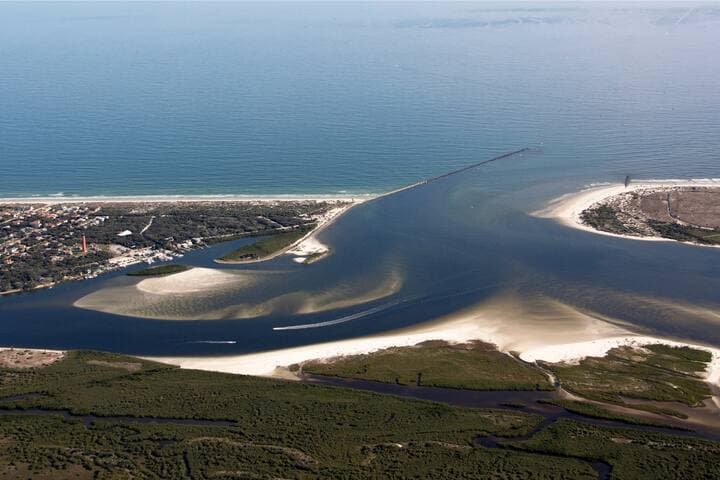 New Smyrna Beach's hidden gem is Smyrna Dunes Park. Sitting on 73-acres of pristine land near Ponce Inlet. Best of all, there's a dog beach - a big, beautiful one surrounded by water on three sides!