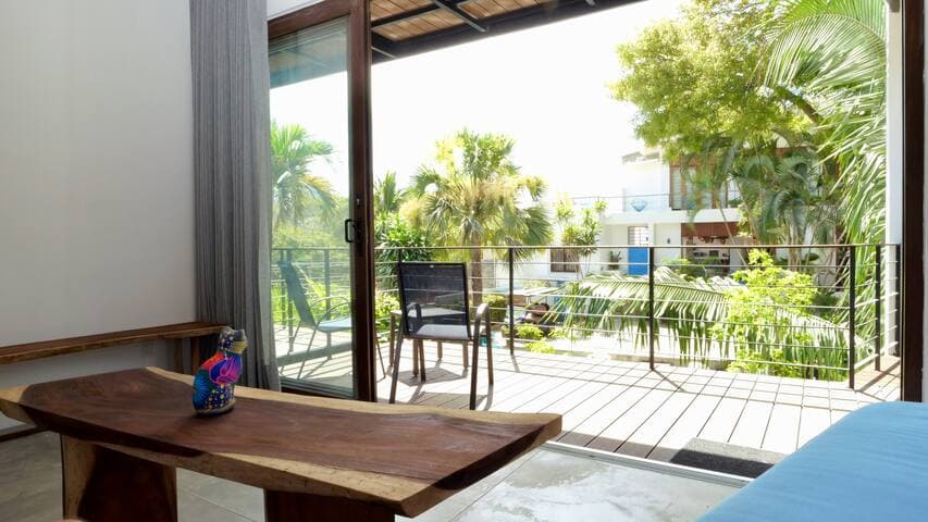 Oversized patio doors that open to bring the outdoors in.