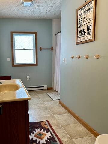 Full bath has plenty of space and features a recently renovated shower, plenty of storage, and large linen closet
