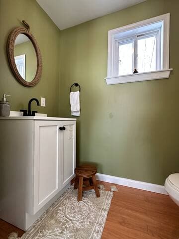 Half bath is located off the living room. It has additional storage for guests utilizing the pull out couch to store their personal items.
