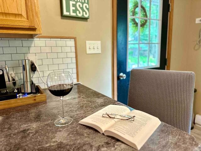 Kitchen had counter seating for 1 - a great casual spot for working or keeping the cook company!