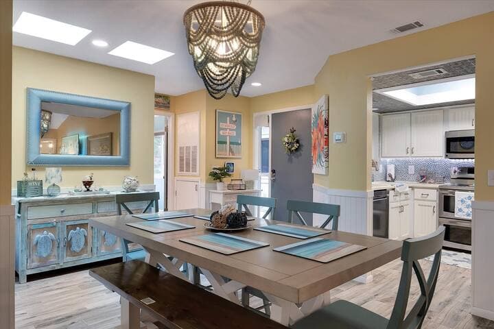 View from dining room facing kitchen and main entrance.