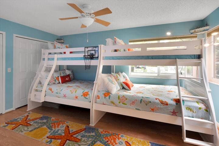 Second bedroom features two full-size beds and two twin overhead bunks.