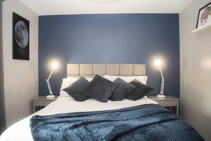 Deluxe mattress on a king size bed featuring a triple wardrobe, comfy chair and mood lighting.