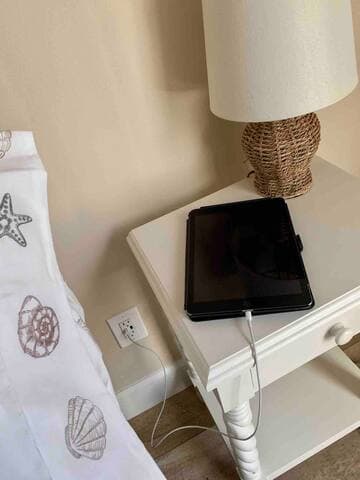 Outlets with USB plugs are conveniently placed next to master bed and between twin beds in guest room.