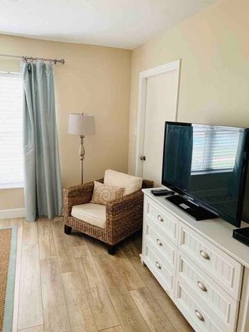 Master bedroom has room to stretch out including plenty of storage, seating area to read or check the surf or pool activity!